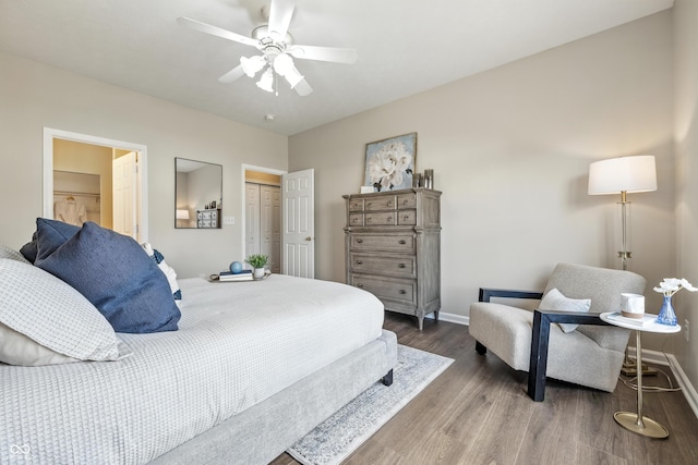 12404 Titans Dr, Fishers, IN 46037 - bedroom with wood finished floors, a closet, and ceiling fan