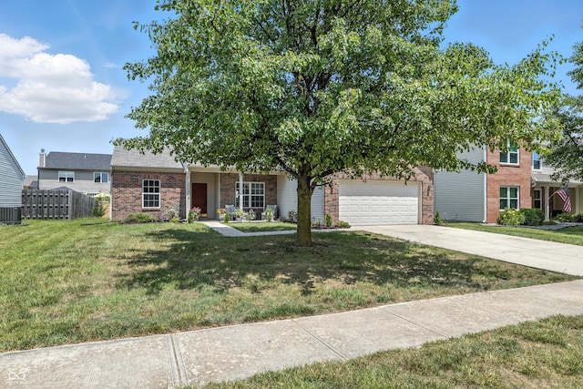 12404 Titans Dr, Fishers, IN 46037 - view of front of property with brick siding, driveway, and a garage