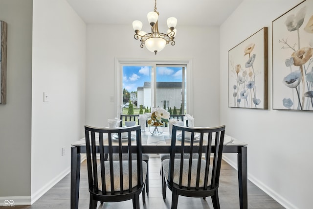 12404 Titans Dr, Fishers, IN 46037 - dining room with a chandelier and wood finished floors