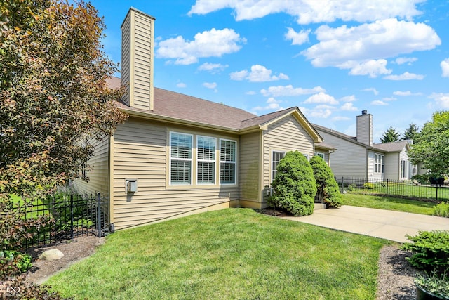16130 Matlock Cir, Westfield, IN 46074 - rear view of house with a chimney and a patio