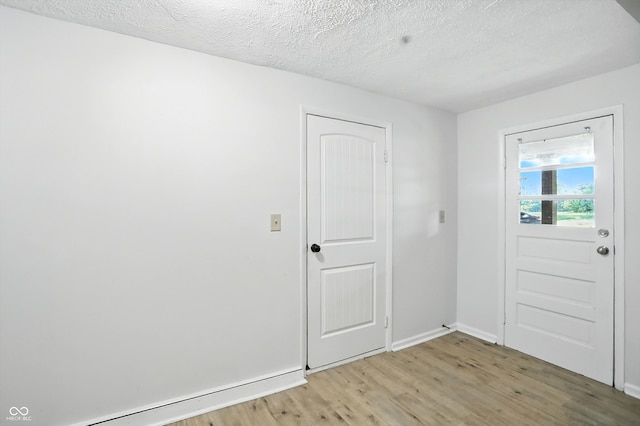 4765 E 200 N, Anderson, IN 46012 - entrance foyer with light wood-type flooring and a textured ceiling
