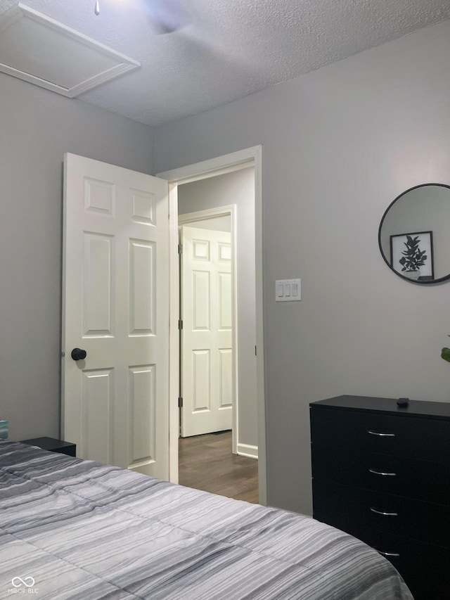 2822 Tindall St, Indianapolis, IN 46203 - bedroom featuring dark wood-type flooring and a textured ceiling