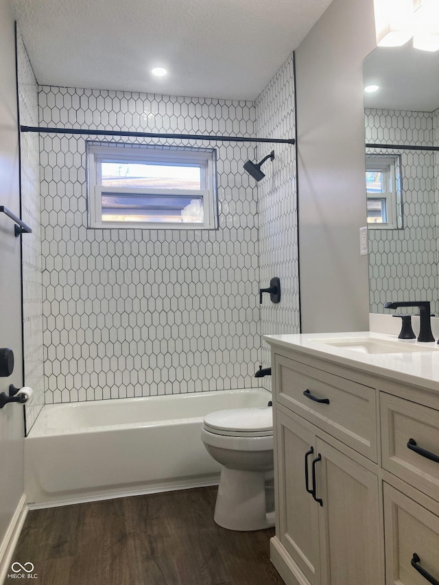 2822 Tindall St, Indianapolis, IN 46203 - bathroom featuring vanity, washtub / shower combination, and wood finished floors