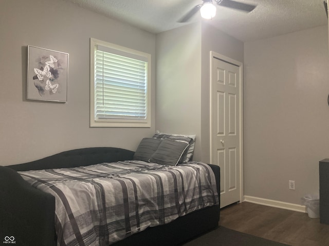 2822 Tindall St, Indianapolis, IN 46203 - bedroom featuring wood finished floors, a textured ceiling, and a ceiling fan