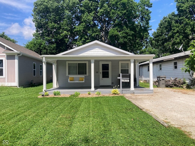 2822 Tindall St, Indianapolis, IN 46203 - view of front of house with a porch and a front lawn