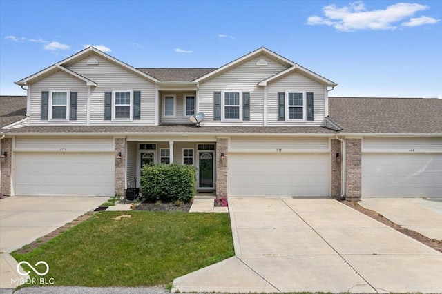 1158 Thistlewood Way, Plainfield, IN 46168 - view of front of house featuring a garage, concrete driveway, and brick siding