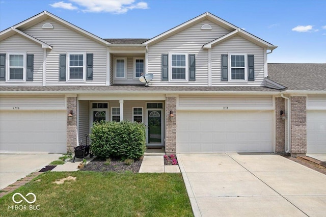 1158 Thistlewood Way, Plainfield, IN 46168 - townhome / multi-family property with brick siding, an attached garage, and concrete driveway