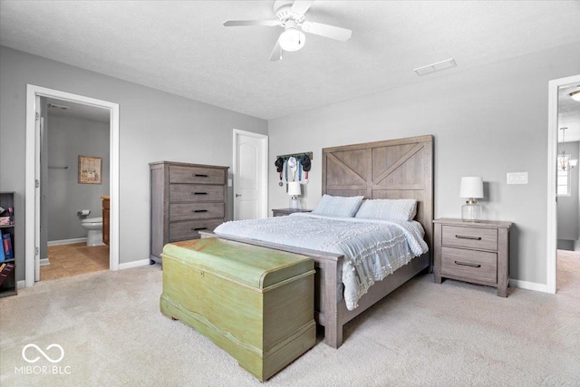 1158 Thistlewood Way, Plainfield, IN 46168 - bedroom with light colored carpet, ensuite bath, and ceiling fan