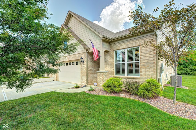 1432 Hideaway Cir, Brownsburg, IN 46112 - view of front of home with concrete driveway, an attached garage, a front lawn, and brick siding