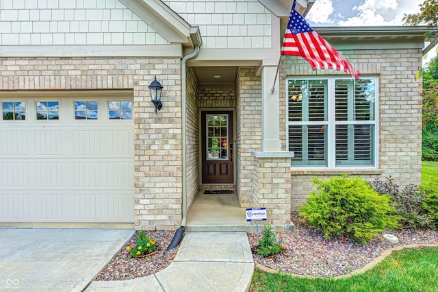 1432 Hideaway Cir, Brownsburg, IN 46112 - view of exterior entry with a garage and brick siding
