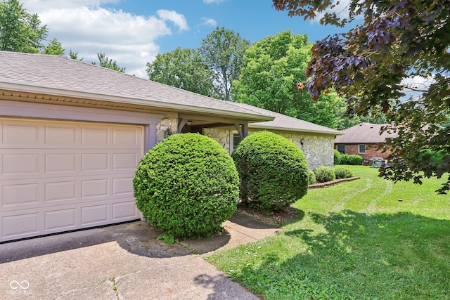 1441 N 700 W, Greenfield, IN 46140 - view of front of house with stone siding, a front yard, driveway, and roof with shingles