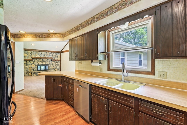 1441 N 700 W, Greenfield, IN 46140 - kitchen with dishwasher, black refrigerator, a textured ceiling, dark brown cabinets, and light countertops