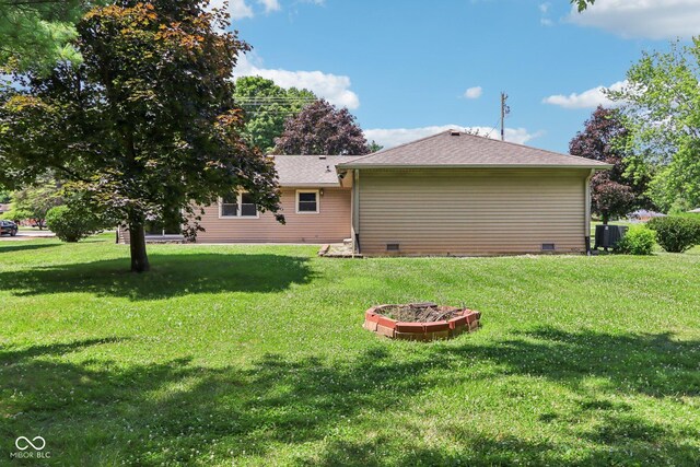 1441 N 700 W, Greenfield, IN 46140 - back of house with crawl space and a yard