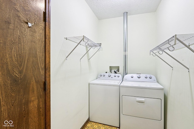 1441 N 700 W, Greenfield, IN 46140 - laundry area featuring washer and dryer and a textured ceiling