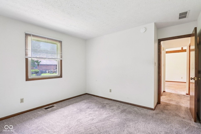 1441 N 700 W, Greenfield, IN 46140 - spare room featuring carpet flooring, a textured ceiling, and a smoke detector