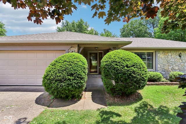 1441 N 700 W, Greenfield, IN 46140 - ranch-style home featuring stone siding, a garage, a front lawn, and a shingled roof