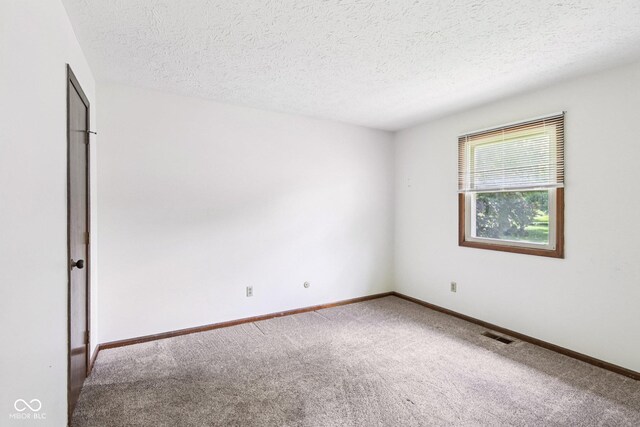1441 N 700 W, Greenfield, IN 46140 - carpeted spare room with a textured ceiling and baseboards