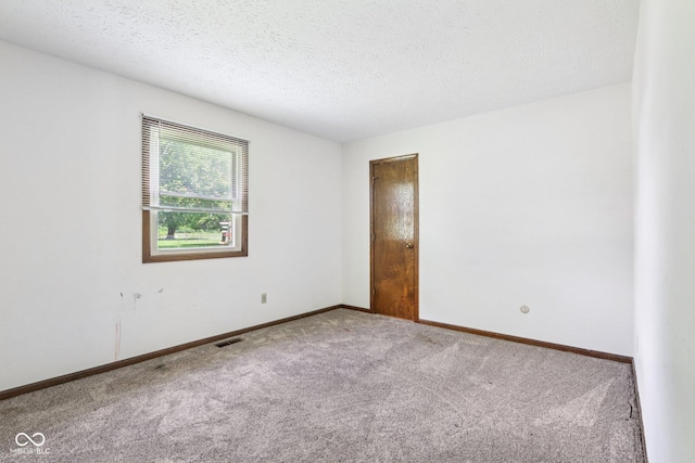1441 N 700 W, Greenfield, IN 46140 - spare room featuring carpet floors and a textured ceiling