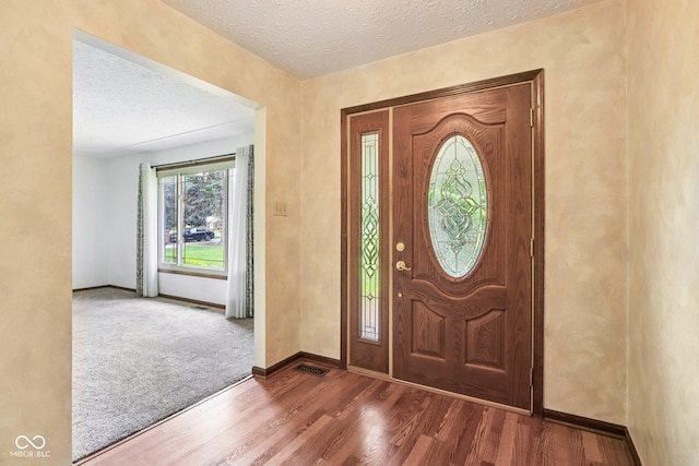 1441 N 700 W, Greenfield, IN 46140 - foyer featuring wood finished floors and a textured ceiling