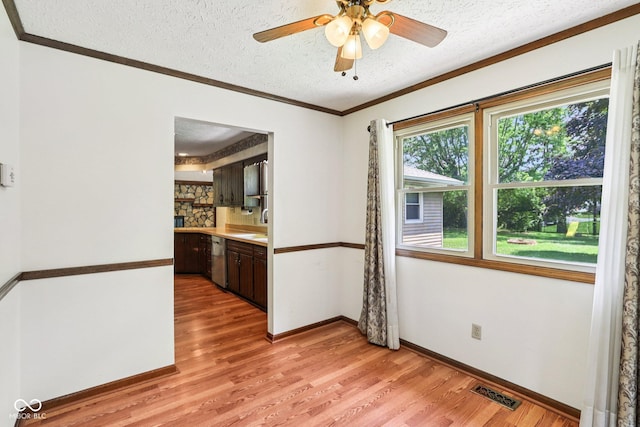 1441 N 700 W, Greenfield, IN 46140 - empty room featuring light wood-type flooring, a textured ceiling, ornamental molding, and a ceiling fan