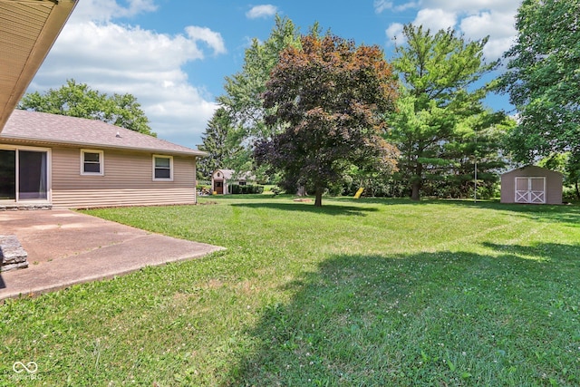 1441 N 700 W, Greenfield, IN 46140 - view of green lawn featuring a storage unit and a patio area