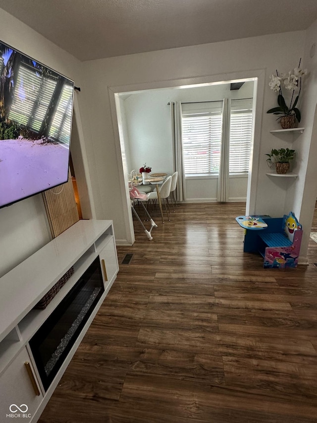 3711 Hillside Ave, Indianapolis, IN 46218 - dining space with dark wood-style flooring and baseboards