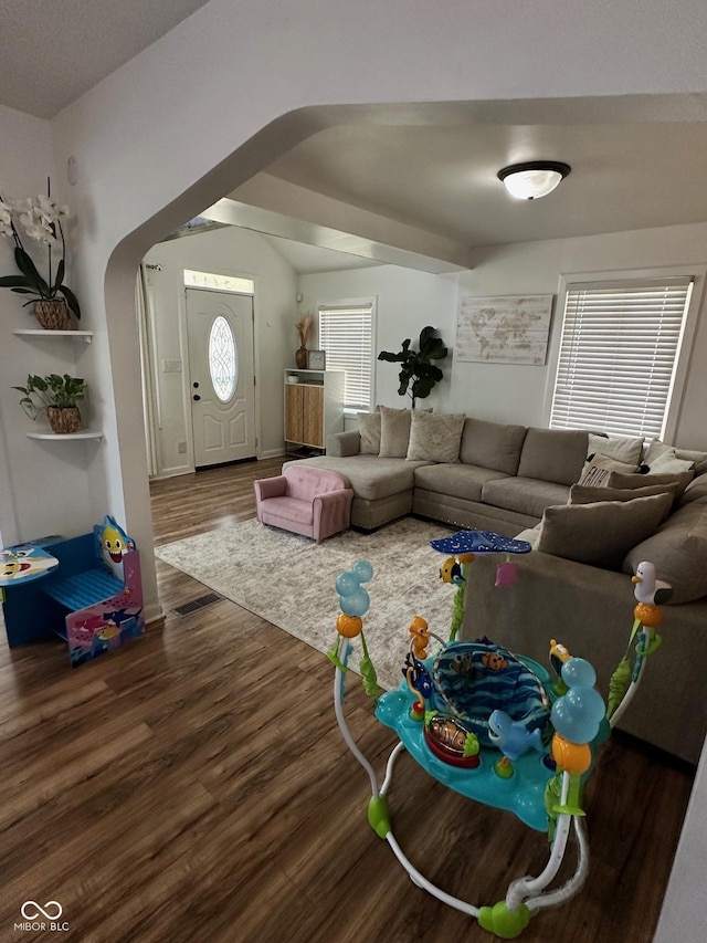 3711 Hillside Ave, Indianapolis, IN 46218 - living area with arched walkways and wood finished floors