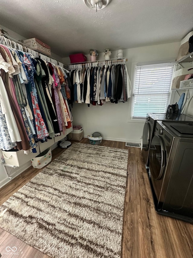 3711 Hillside Ave, Indianapolis, IN 46218 - spacious closet featuring washing machine and dryer and wood finished floors