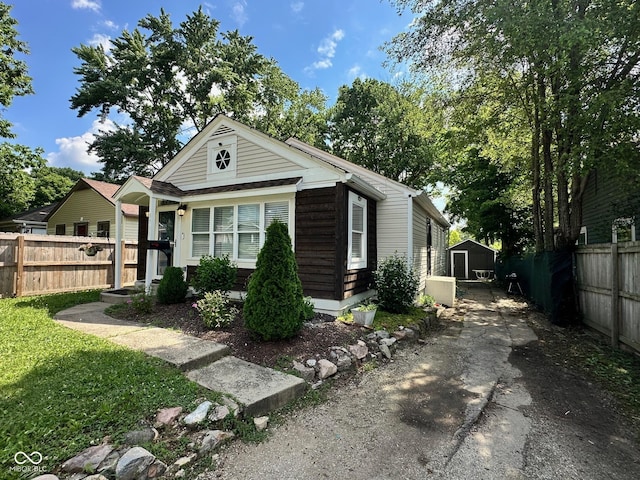 3711 Hillside Ave, Indianapolis, IN 46218 - view of front facade featuring asphalt driveway and a storage shed