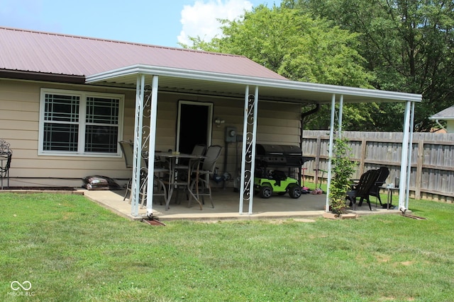1504 Gwinn Ln, Lapel, IN 46051 - rear view of house featuring a metal roof, an attached carport, and a patio