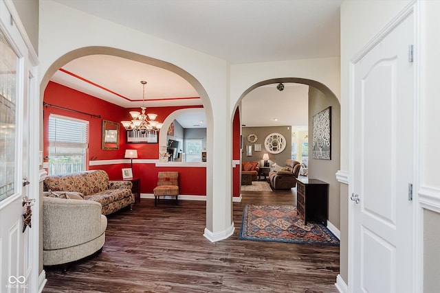 7092 Bridgemont Ct, Avon, IN 46123 - foyer entrance featuring dark wood-type flooring, healthy amount of natural light, arched walkways, and a chandelier
