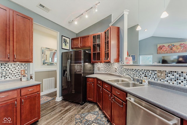 7092 Bridgemont Ct, Avon, IN 46123 - kitchen featuring black fridge with ice dispenser, stainless steel dishwasher, vaulted ceiling, backsplash, and wood finished floors