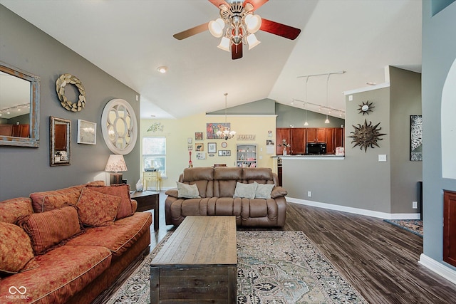 7092 Bridgemont Ct, Avon, IN 46123 - living room featuring ceiling fan, dark wood-type flooring, lofted ceiling, rail lighting, and a chandelier