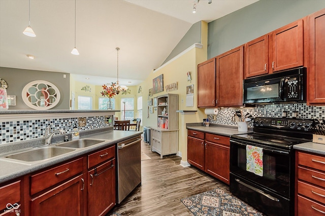 7092 Bridgemont Ct, Avon, IN 46123 - kitchen with black appliances, dark wood finished floors, tasteful backsplash, decorative light fixtures, and dark countertops