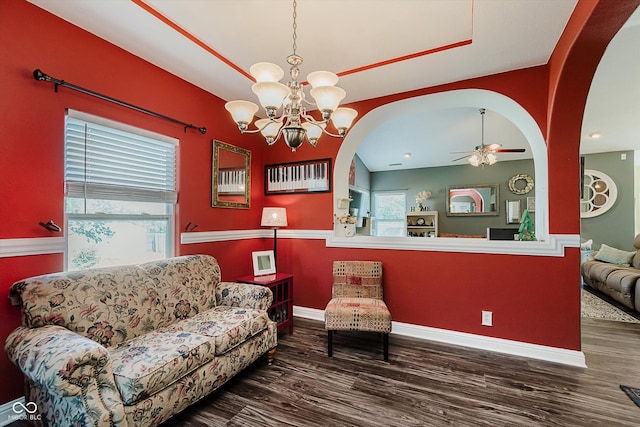 7092 Bridgemont Ct, Avon, IN 46123 - living area with plenty of natural light, wood finished floors, arched walkways, and a chandelier