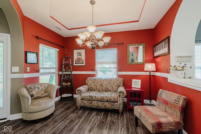 7092 Bridgemont Ct, Avon, IN 46123 - sitting room with arched walkways, a chandelier, and wood finished floors