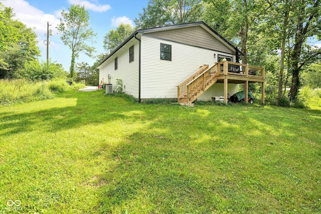 301 Beech Rd, North Vernon, IN 47265 - back of property featuring stairway, a wooden deck, and a yard