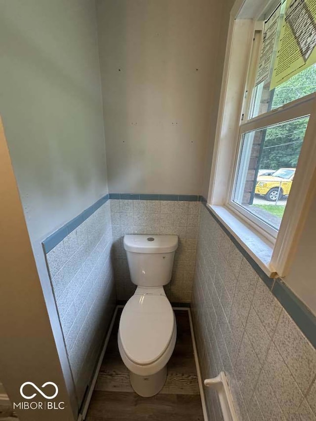 1941 W Booe Rd, Austin, IN 47102 - bathroom with tile walls, a wainscoted wall, and wood finished floors