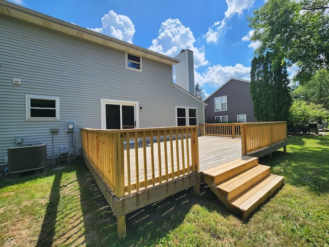4536 Clayburn Dr, Indianapolis, IN 46268 - back of property with a yard, a deck, and a chimney