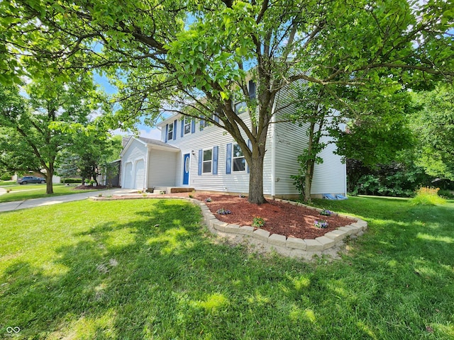 4536 Clayburn Dr, Indianapolis, IN 46268 - colonial inspired home featuring a front yard, driveway, and an attached garage