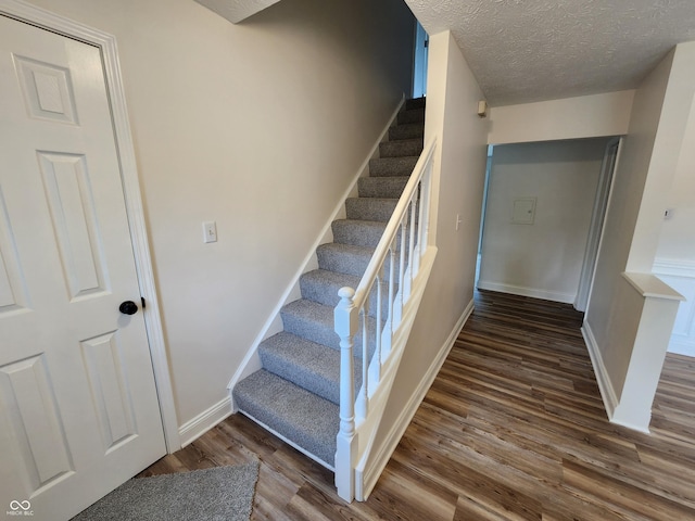 4536 Clayburn Dr, Indianapolis, IN 46268 - stairway with wood finished floors and baseboards