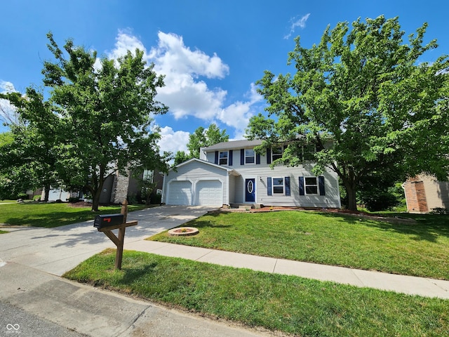 4536 Clayburn Dr, Indianapolis, IN 46268 - colonial home featuring concrete driveway, a front yard, and an attached garage