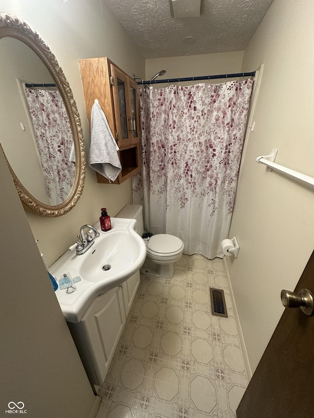 7607 Ardwell Ct, Indianapolis, IN 46237 - bathroom with a textured ceiling, vanity, tile patterned floors, and a shower with curtain