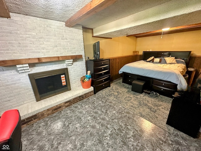 7607 Ardwell Ct, Indianapolis, IN 46237 - bedroom featuring a textured ceiling, wainscoting, a fireplace, and wooden walls