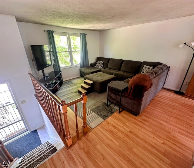 7607 Ardwell Ct, Indianapolis, IN 46237 - living room featuring light wood-style flooring and a textured ceiling