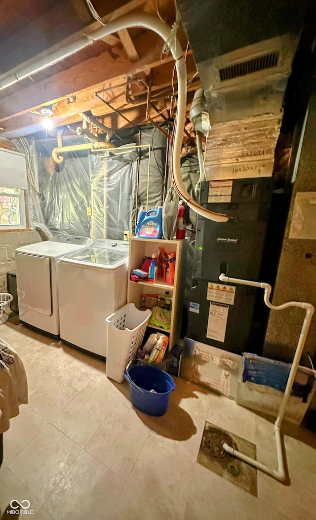 7607 Ardwell Ct, Indianapolis, IN 46237 - basement featuring washing machine and clothes dryer and tile patterned floors