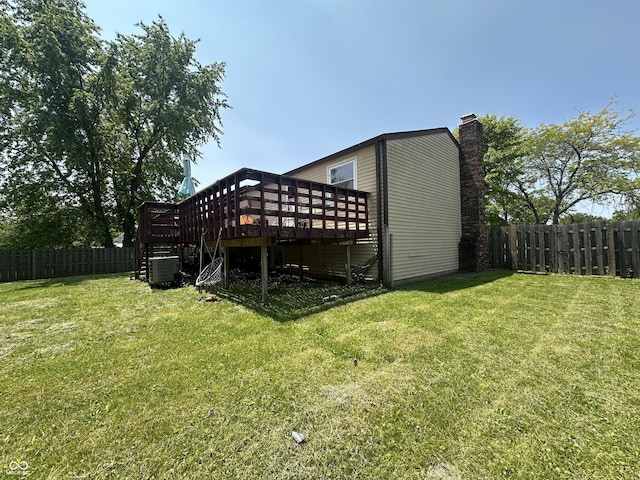 7607 Ardwell Ct, Indianapolis, IN 46237 - rear view of house with a deck, a fenced backyard, a chimney, and stairs