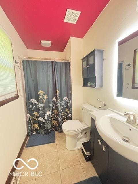 6546 Derbyshire Rd, Indianapolis, IN 46227 - bathroom with tile patterned flooring, vanity, vaulted ceiling, and a shower with curtain