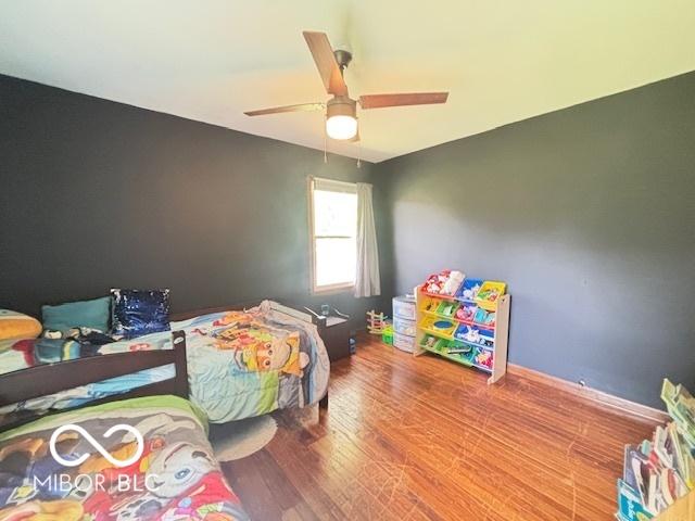 6546 Derbyshire Rd, Indianapolis, IN 46227 - bedroom with wood finished floors and a ceiling fan