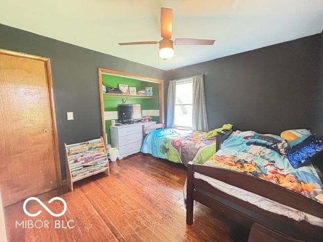 6546 Derbyshire Rd, Indianapolis, IN 46227 - bedroom featuring wood finished floors and ceiling fan